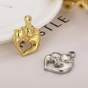 Detail of gold and silver heart-shaped hugging animals charms with high-polish finish