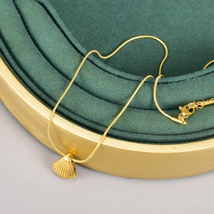Marine style 18K gold plated stainless steel snake chain with a shell pendant