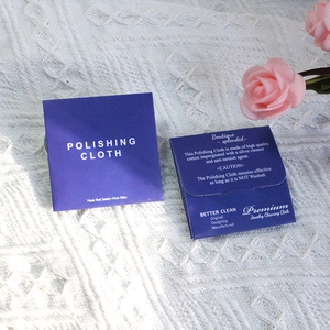Polishing cloth in dark blue packaging for cleaning jewelry with cotton fabric