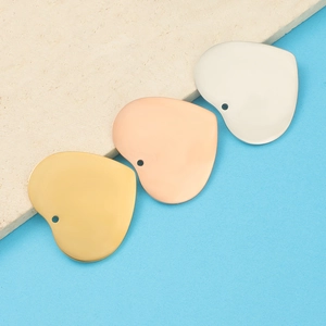 Polished 33mm heart pendants in gold, rose gold, and silver finishes for DIY jewelry
