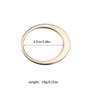 Detail view of the 6.3cm diameter gold plated open bangle with size and weight specs