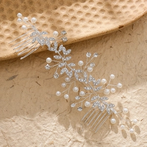 Exquisite bridal hair comb set with sparkling rhinestones and pearls in silver leaf design