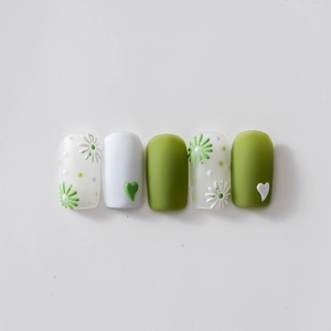 Green and white floral 5D embossed nail stickers featuring small daisies and matte hearts