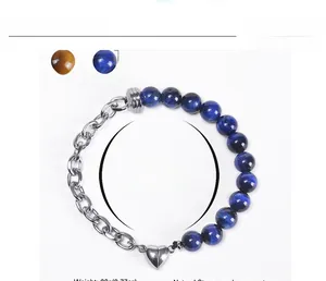 Detail of blue tiger eye stone beads and silver chain with heart magnetic clasp