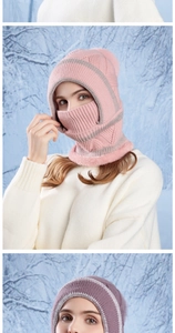 Detail of pink knitted winter hat with thick plush lining and integrated face mask