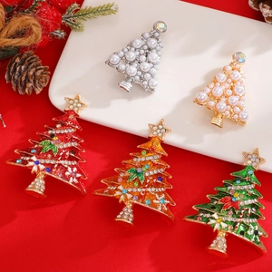 Detailed view of colorful Christmas tree brooches with pearls and rhinestones on festive background