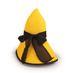 Detail of yellow straw sun hat featuring a large black mesh bow and unique pointed top