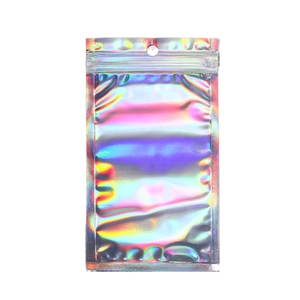 Close-up of holographic laser resealable bag with rainbow effect on white background