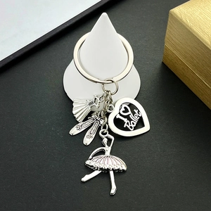 Detailed silver ballerina keychain featuring fan, shoes, and heart charm with I Love Ballet text