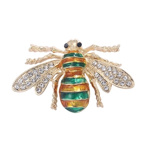 Sparkling bee brooch with green enamel and rhinestone wings in golden alloy finish