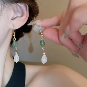 Minimalist Chinese-style gold drop earrings with green beads and white stone pendants