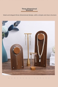 Detail of walnut wood jewelry display set with golden T-bars for necklaces and bracelets
