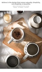 Artistic top view of four Nordic ceramic mugs with varied textures on white linen fabric