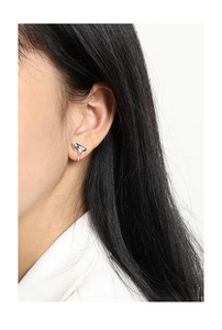 Close-up of minimalist S925 sterling silver stud earring with liquid metal irregular design