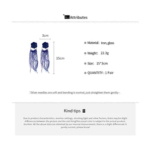Detail of blue flower long tassel earrings showing crystal accents and 15cm drop length
