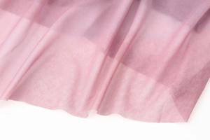 Detail of pink mesh fabric showing lightweight breathable texture and delicate mesh weave