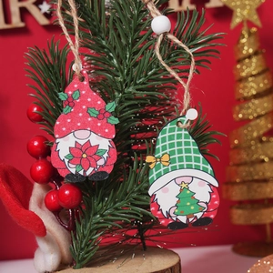 Detailed close-up of handmade wooden Christmas gnome ornaments hanging on a festive tree