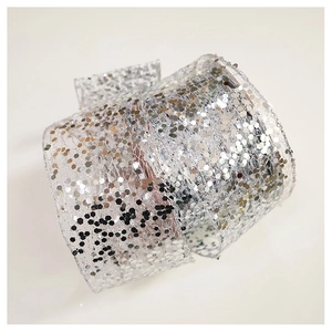 Detail of high-density silver sequin ribbon for Christmas tree decor and floral wrap