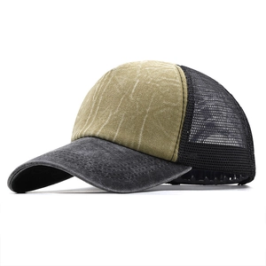 Detail view of washed denim baseball cap with yellow front panel and black mesh back