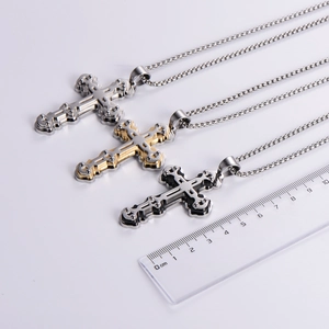 Three multi-layer cross pendant necklaces in silver gold and black with size ruler