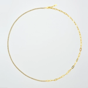 Macro detail of S925 sterling silver chain with pavé white zircons and paperclip links
