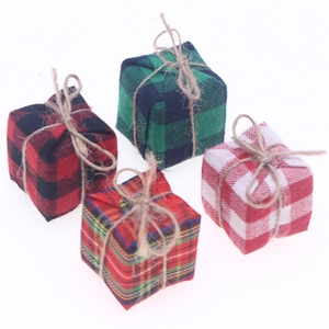 Set of four Christmas plaid fabric gift box ornaments with rustic twine bows