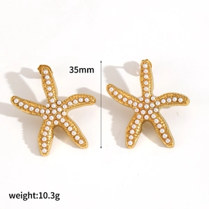 Detail view of starfish earrings showing 35mm height and 10.3g weight measurement