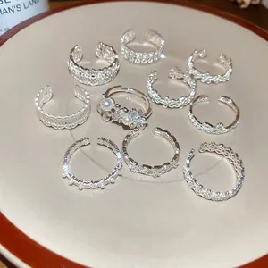 Elegant 10-piece silver ring set with zircon floral lace and pearl details