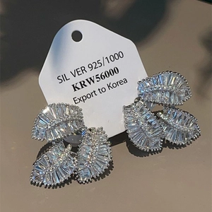 Three-layer silver leaf earrings with shimmering cubic zirconia pavé on a mirror base