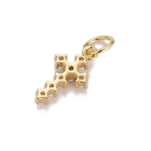 Detailed macro view of a gold-plated cross pendant with textured finish and top bail