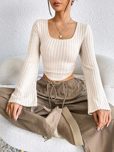 Detail of cream rib-knit crop top with wide square neckline and long flared sleeves