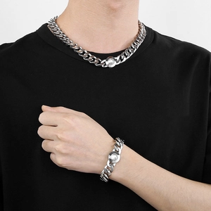 Polished silver Cuban link chain necklace and bracelet set with geometric faceted clasp