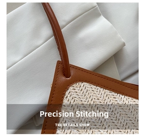 Detail shot of precise stitching on brown leather and woven texture of the bucket bag