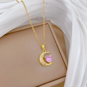 Titanium steel gold necklace featuring a crescent moon and pink heart crystal pendant