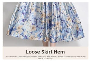 Detail of satin floral dress hem showing light blue fabric and smooth silky texture