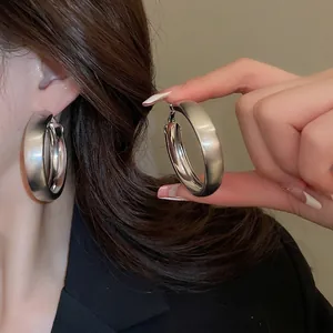 Minimalist silver matte brushed wide hoop earrings for women in a stylish modern design