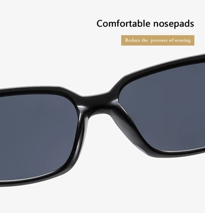 Detail of comfortable nosepads on stylish black square frame sunglasses with dark lenses