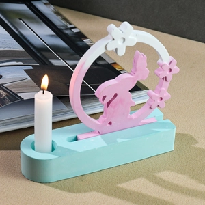 Detail of DIY oval silicone mold candle holder with rabbit silhouette and floral design