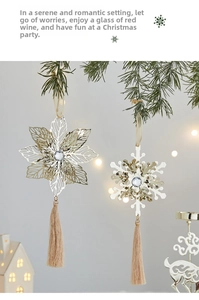 Detail of metal Christmas tree ornaments with snowflakes and elegant silk tassels