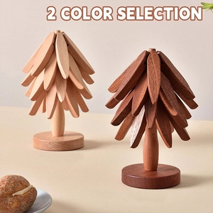 Detail view of solid wood tree-shaped coasters in natural and walnut finishes