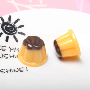 Detailed macro view of resin pudding miniatures on a white plate for DIY crafts