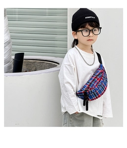 Detailed view of red and blue checkered kids chest bag with adjustable black strap