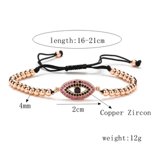 Detail of rose gold evil eye bracelet showing copper beads and zircon inlay measurements