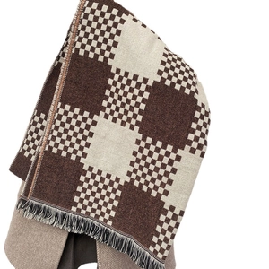 Thick checkered scarf with brown and beige color block pattern and tassel fringe details