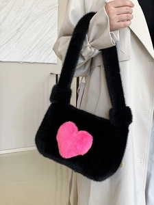 Chic black plush shoulder bag featuring a cute pink heart pattern for women's autumn style