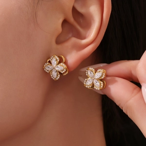 Golden four-leaf flower earrings set with sparkling marquise-cut white zircons