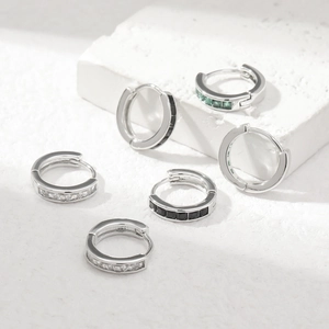 Silver hypoallergenic huggie earrings set with square white, black and emerald zircons