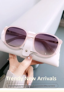 Detail of pink transparent frame sunglasses with purple gradient lenses and leather case