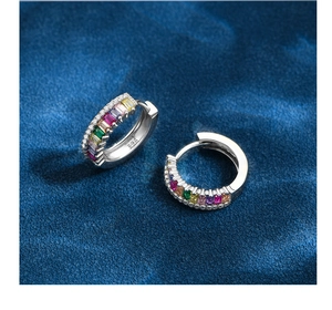 Macro detail of S925 sterling silver hoop earrings with colorful zircon gemstones