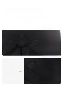Detailed view of black baseball cap featuring precision stitching and Classic embroidery